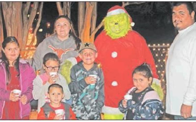 BELOW: The Morales family doesn’t let the Grinch concern them at all. They had a good time at the Teague Hotel on Saturday night, Dec. 7. Photo Richard Nelson/ Teague Chronicle