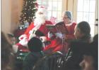 LEFT: Mrs. Claus reads “Santa’s Little Helper with Mickey Mouse” from the “5 Minute Stories from Disney” to all the guest at the Breakfast with Santa event at the Teague Hotel. Mr. Claus entertained everyone by acting out the Santa parts of the 